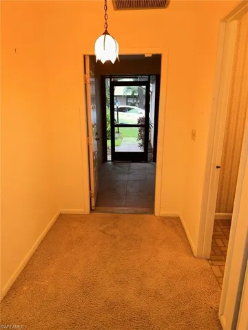 Hall featuring carpet floors