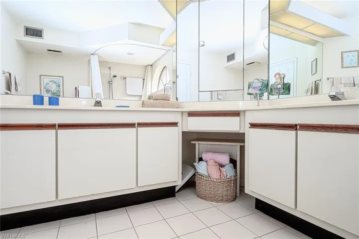 Bathroom with tile patterned flooring and vanity