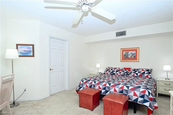 Carpeted bedroom.  leather stools no longer there