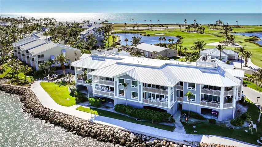 Drone / aerial view of a large body of water and a golf club