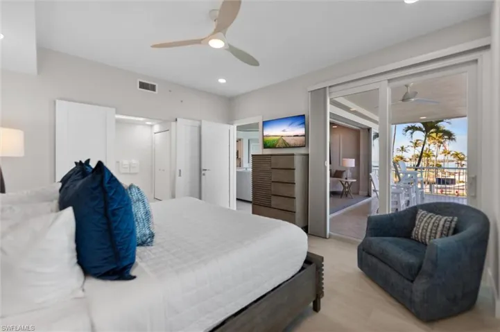 Bedroom featuring access to outside, light wood finished floors, a ceiling fan, and recessed lighting