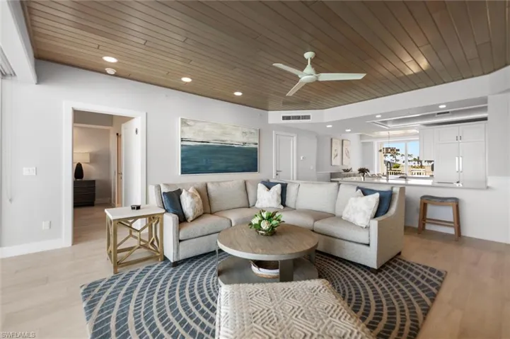 Living room with ceiling fan, wood ceiling, light wood finished floors, and recessed lighting