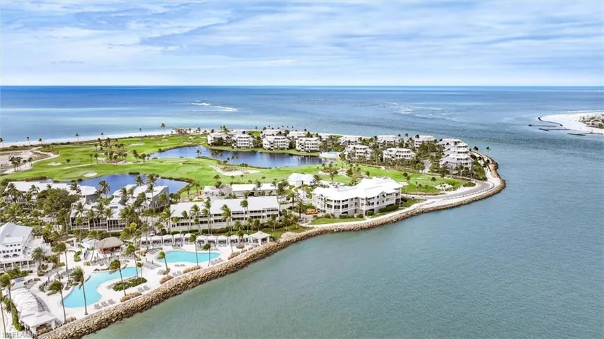 Bird's eye view of a nearby body of water and a golf course