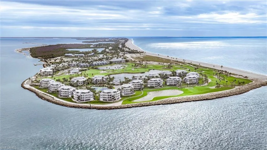 Bird's eye view of a large body of water and apartment complex / building