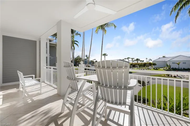 Balcony featuring ceiling fan