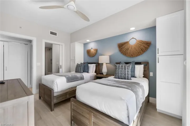 Bedroom featuring ceiling fan, light wood-style floors, and recessed lighting