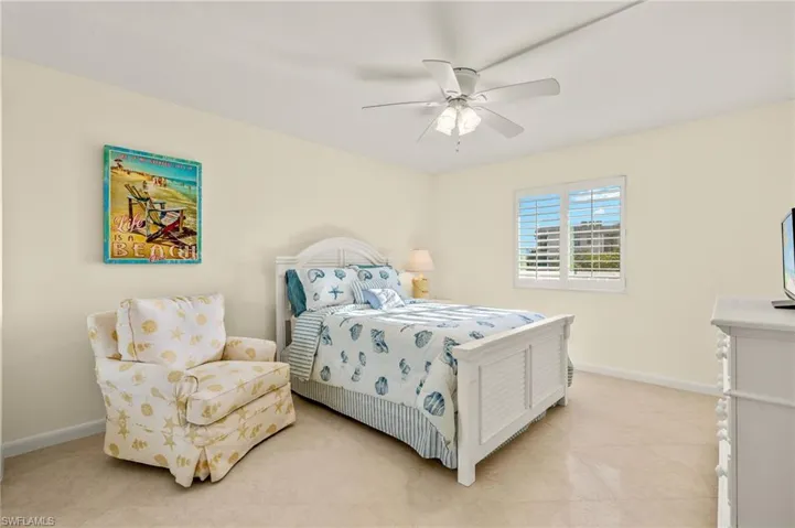 Bedroom featuring ceiling fan and light tile patterned flooring