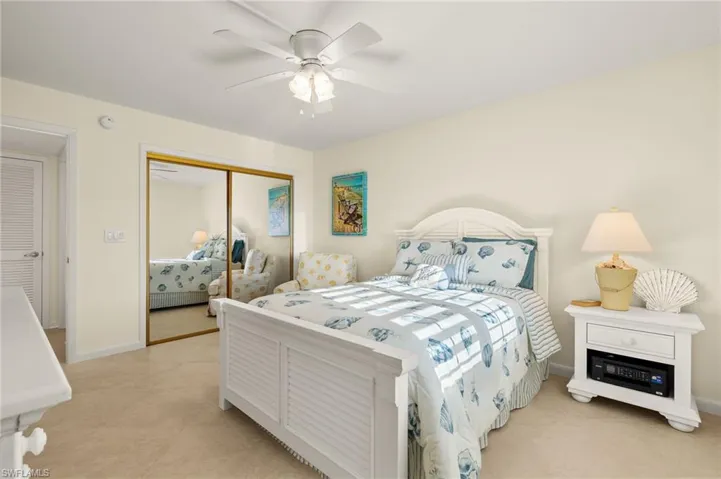 Bedroom featuring a ceiling fan and a closet