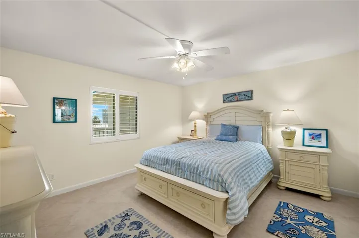 Bedroom with baseboards and ceiling fan