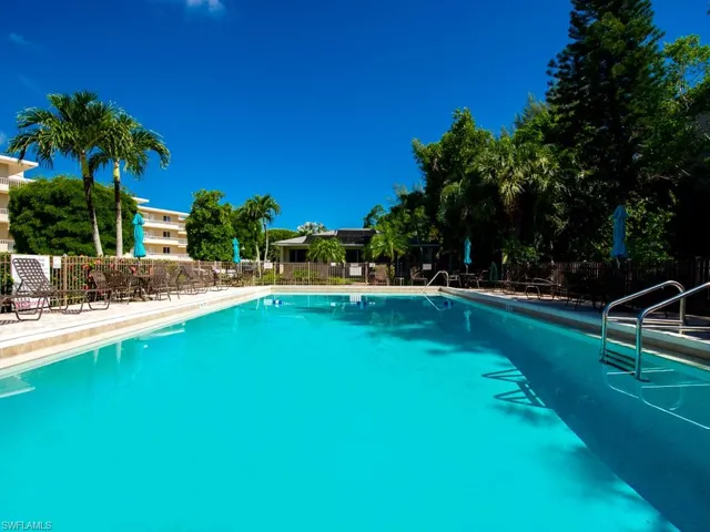 Community pool with a patio area
