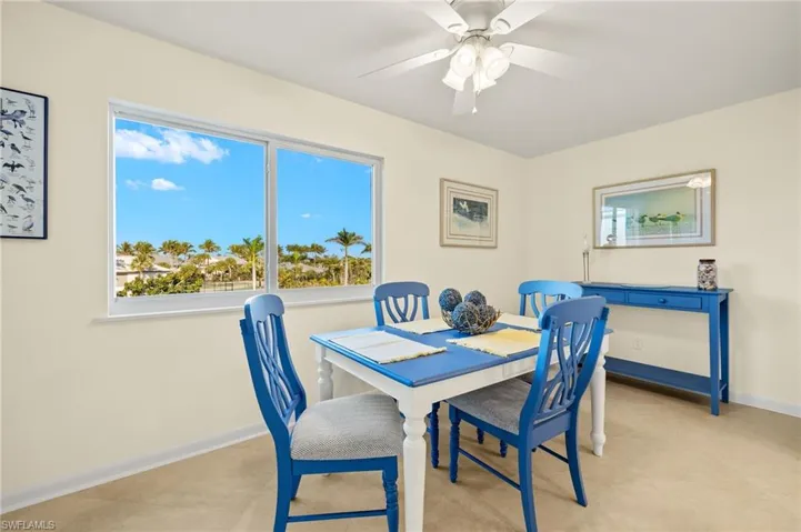 Dining room with baseboards and ceiling fan
