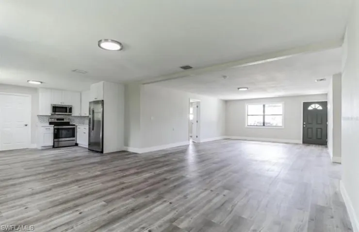 Unfurnished living room with light hardwood / wood-style floors
