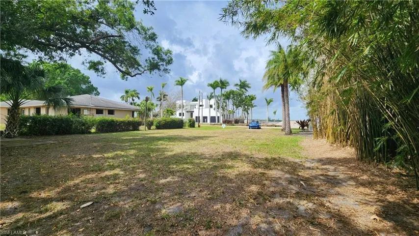 Back of lot along canal from southeast corner of lot to street