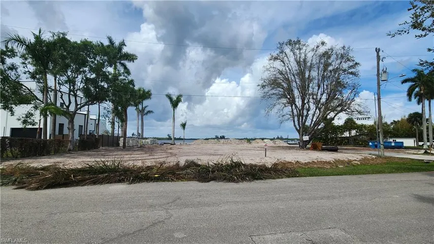 Lot across the street directly on the Caloosahatchee River to be built soon with custom multi-million dollar home