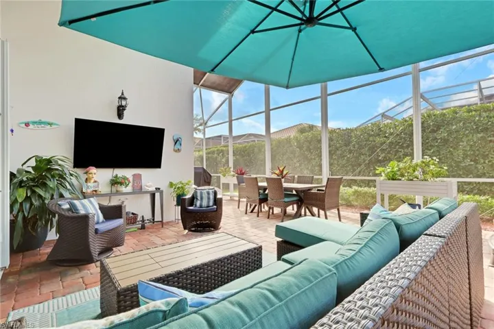 Sunroom with an outdoor hangout area, outdoor dining space, and a patio