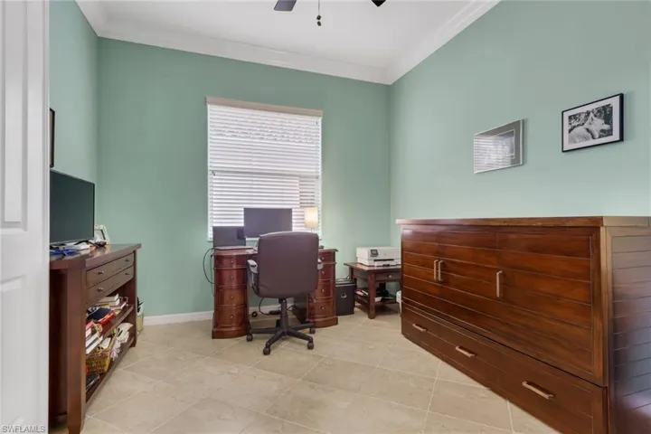 Office space featuring crown molding and ceiling fan