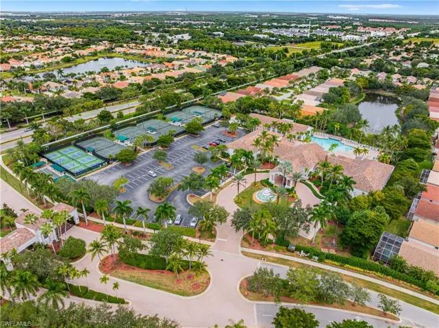 View of property location with a nearby body of water and nearby suburban area
