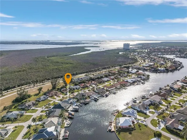 Aerial perspective showcasing waterfront properties with private boat docks