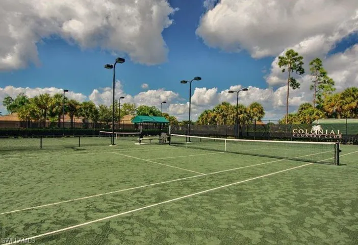 View of sport court featuring fence