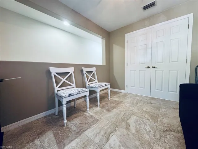 Sitting room featuring baseboards and visible vents