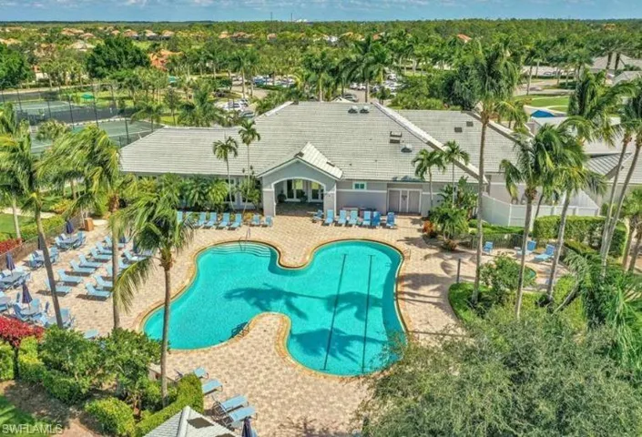 Pool featuring fence and a patio area