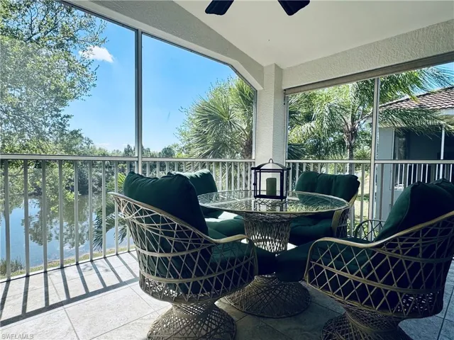 Sunroom / solarium featuring a healthy amount of sunlight and ceiling fan