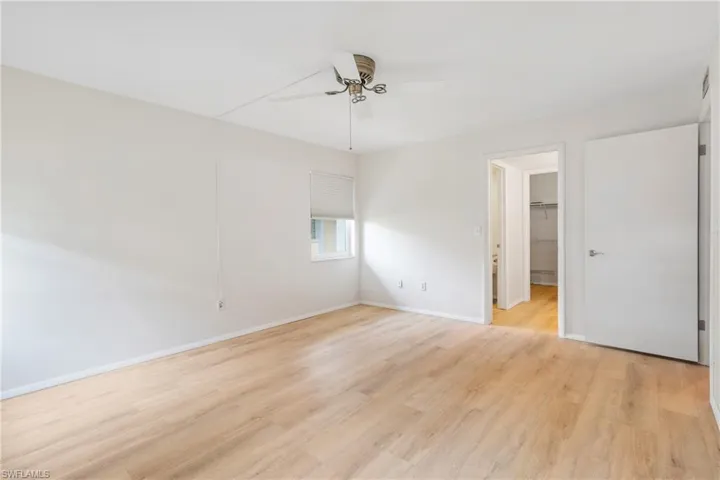 Unfurnished room featuring ceiling fan and light hardwood / wood-style flooring