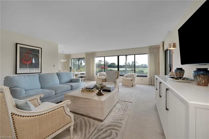 Living area with light colored carpet