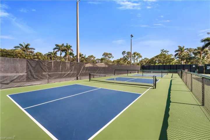 View of tennis court featuring community basketball court