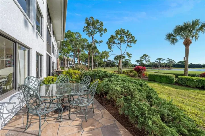 View of patio / terrace featuring outdoor dining area and a water view