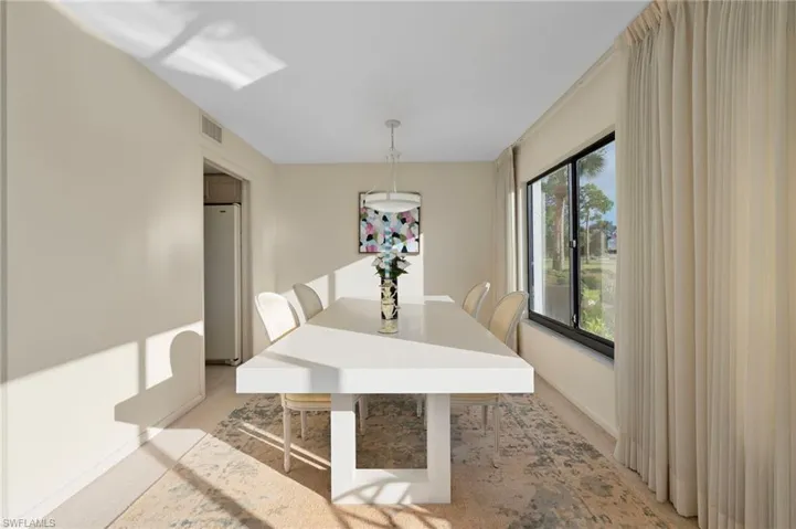 View of carpeted dining room