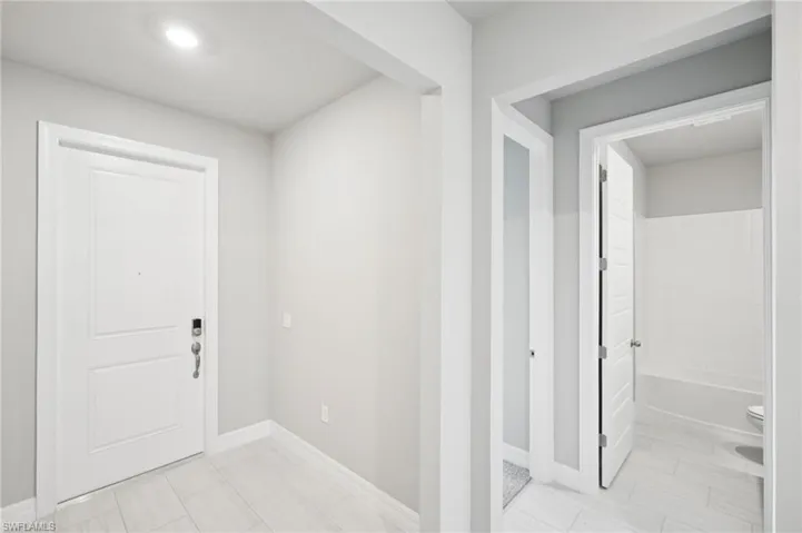 Foyer featuring baseboards