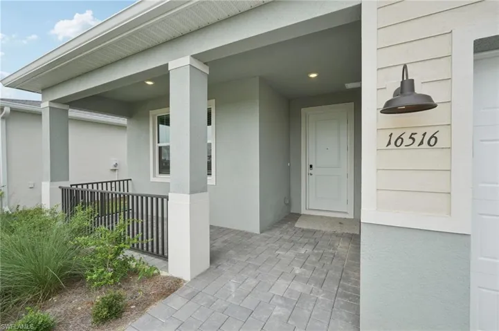Property entrance with stucco siding