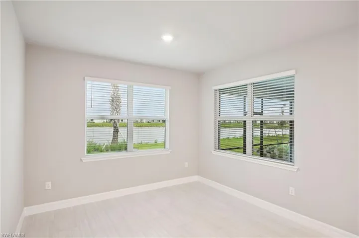 Unfurnished room featuring baseboards and recessed lighting