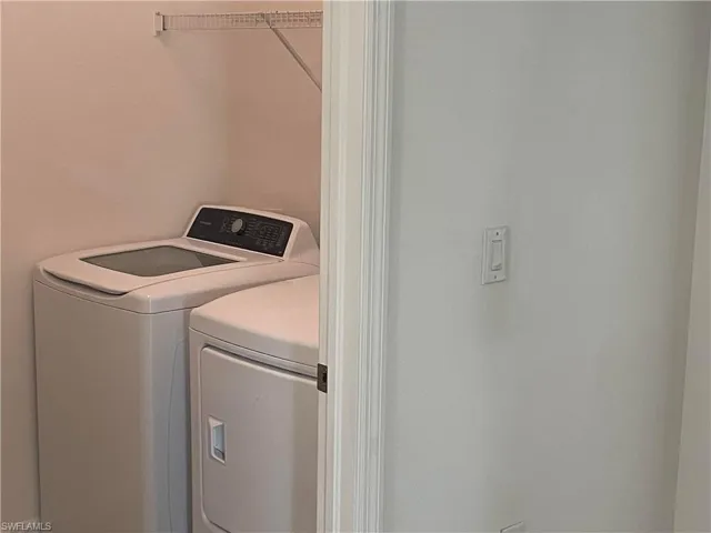 Laundry area featuring separate washer and dryer
