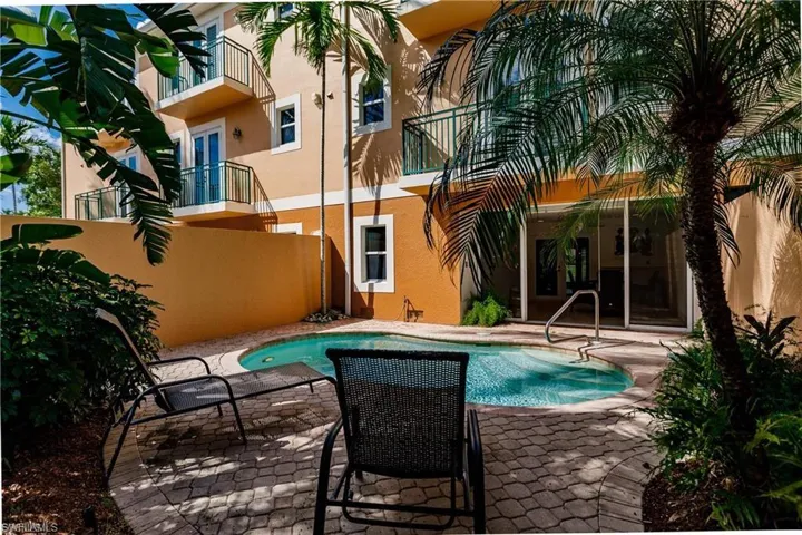 Swimming pool with a balcony and a patio