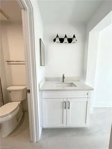 Bathroom with toilet and vanity