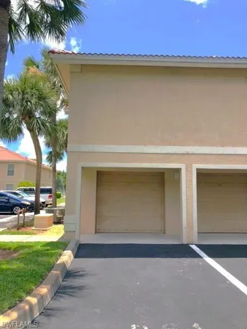 View of community with a patio area and a water view