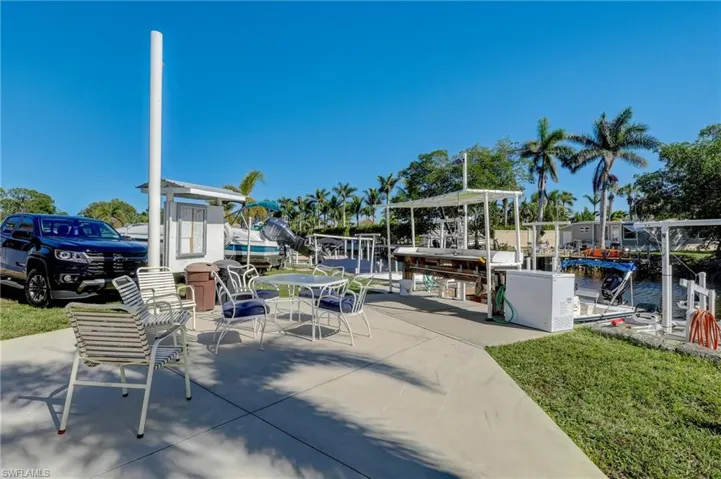 View of patio with a water view