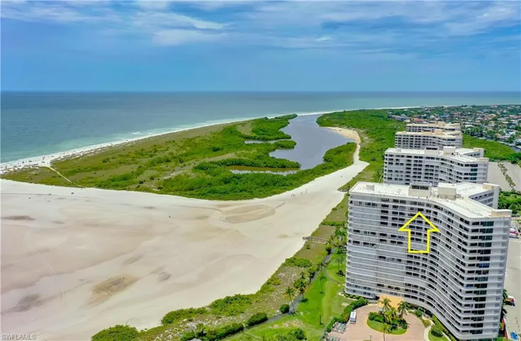 Bird's eye view with a water view and a beach view