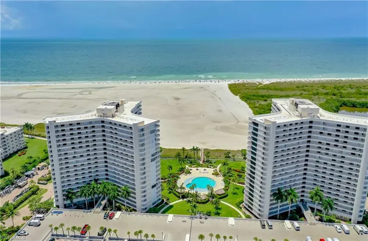 Bird's eye view featuring a water view and a view of the beach