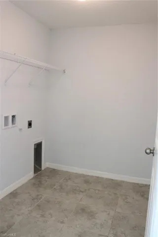 Washroom featuring hookup for a washing machine and electric dryer hookup