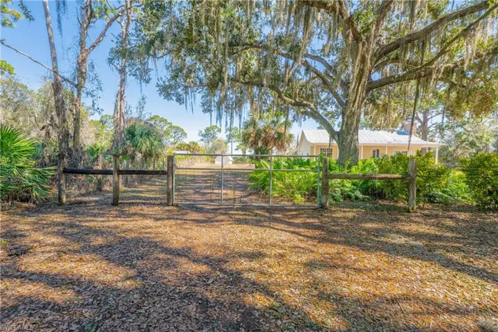 View of yard with a gate