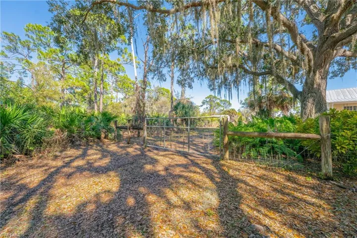 View of yard with a gate