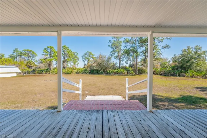 Deck featuring a yard