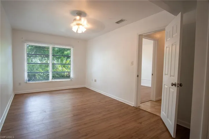 Empty room featuring light hardwood / wood-style flooring and ceiling fan