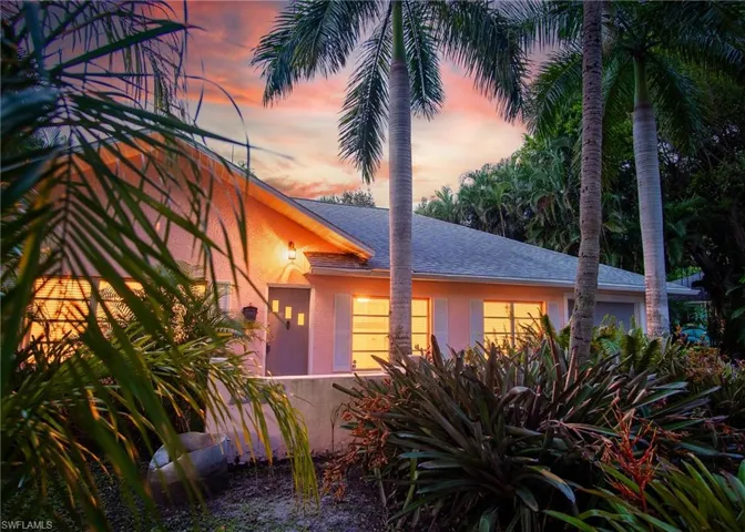 View of property exterior at dusk
