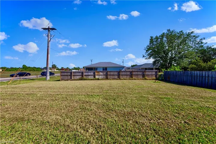 View of yard featuring fence