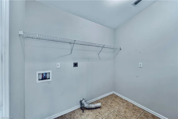 Laundry room with visible vents, baseboards, laundry area, electric dryer hookup, and hookup for a washing machine