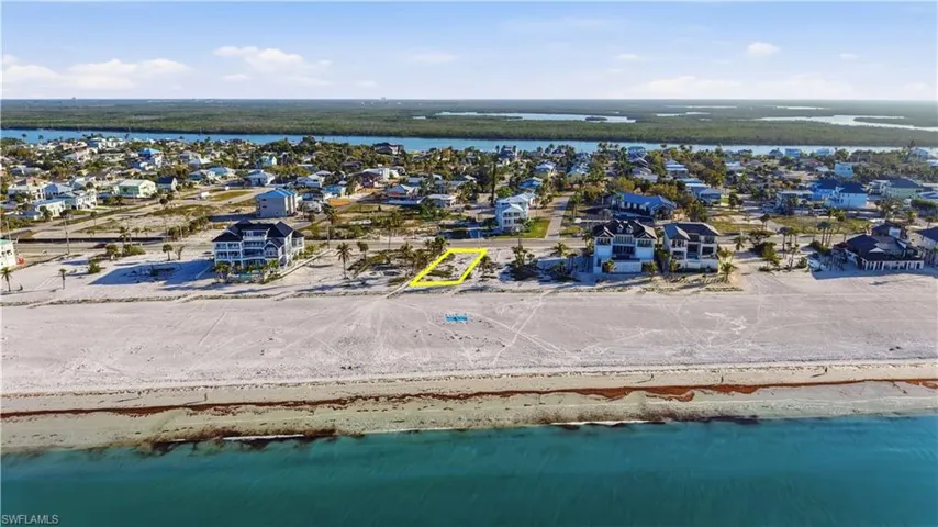 Aerial perspective of suburban area with a large body of water - Virtually Edited Image